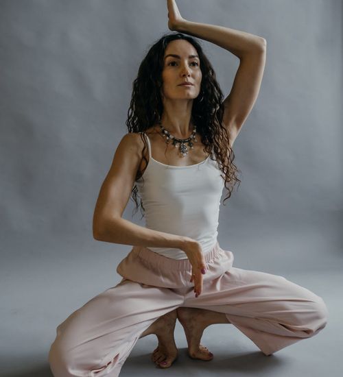 Person in a meditative yoga pose, symbolizing mental clarity and peace.